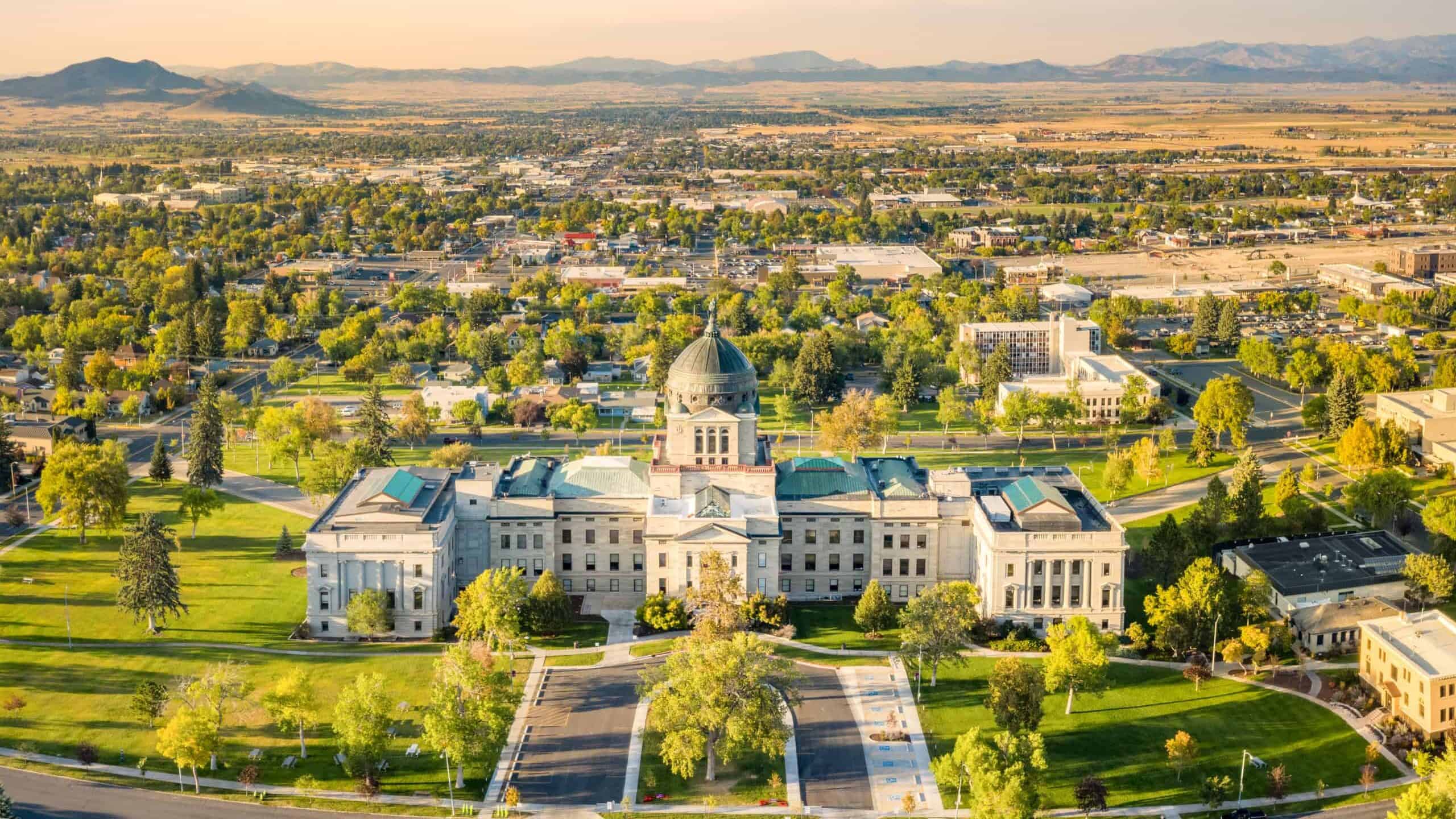 Drone view of the Montana State Capitol, in Helena, on a sunny afternoon with hazy sky caused by wildfires. The Montana State Capitol houses the Montana State Legislature. This is where an attempt on a kratom ban in Montana was made.