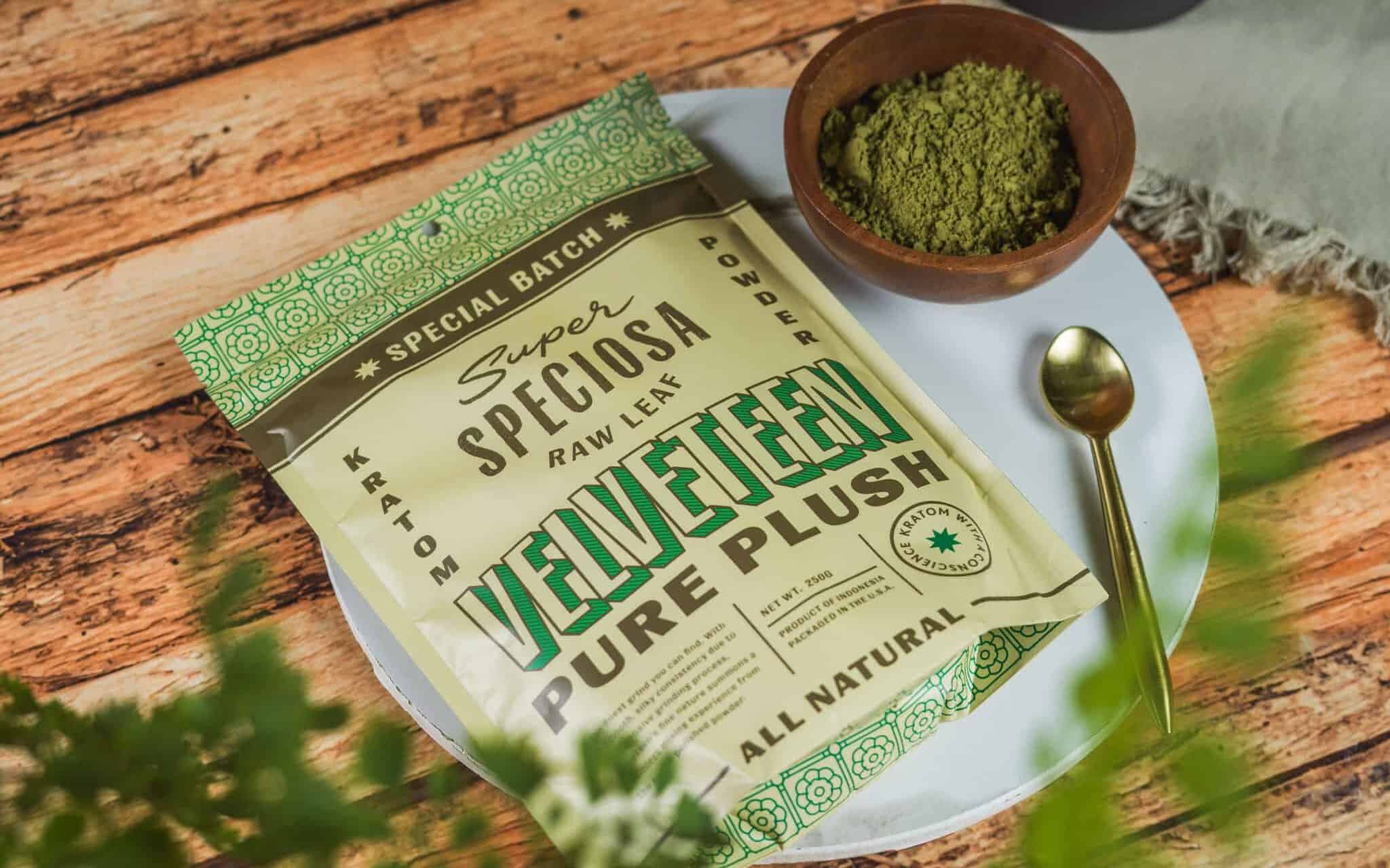 Super Speciosa Velveteen Nano Kratom styled with greenery and a bowl of kratom powder and spoon.