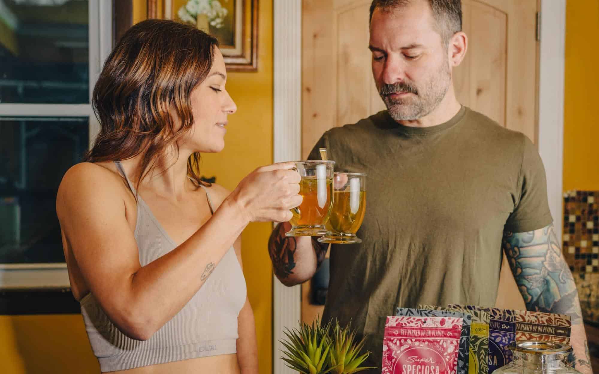 man and woman sharing kratom tea drinks from Super Speciosa, the best place to buy kratom tea.