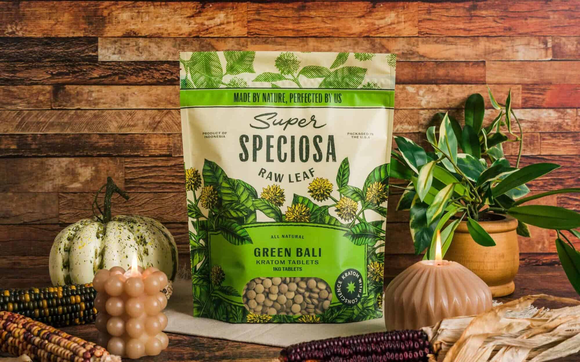 Super Speciosa’s Green Bali Kratom in autumn environment with candles, corn, and pumpkin. Explore the benefits of green kratom.